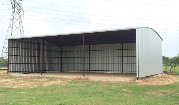 30'x50'x12' Metal Building enclosed on 3 sides. Built on dirt floor.